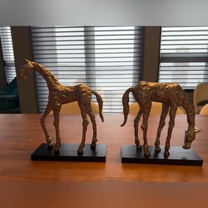 2 Uttermost Silvertoned Horse Sculptures. Solid on black painted base. 12” & 10”